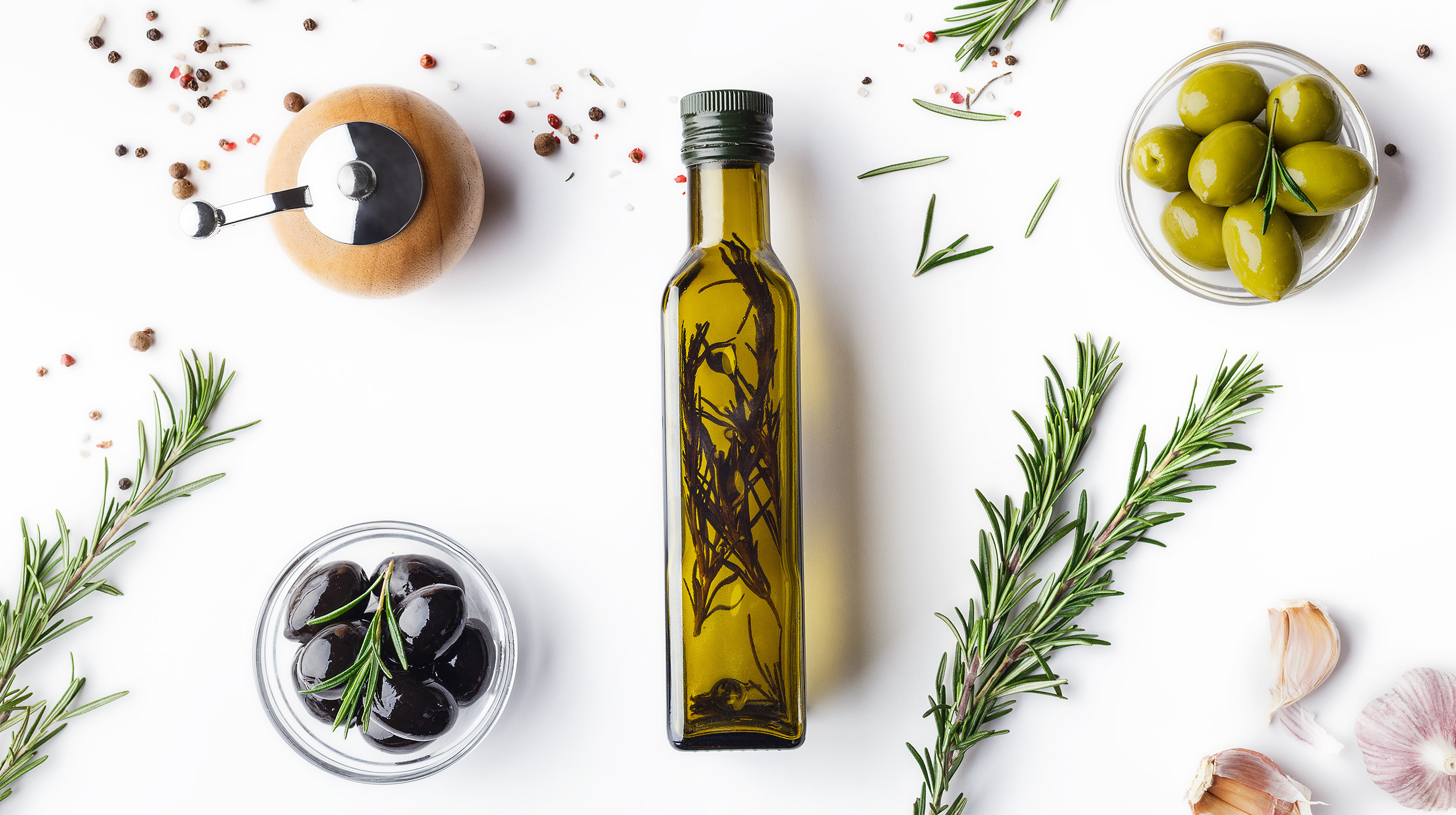 oil & olive placed on a table